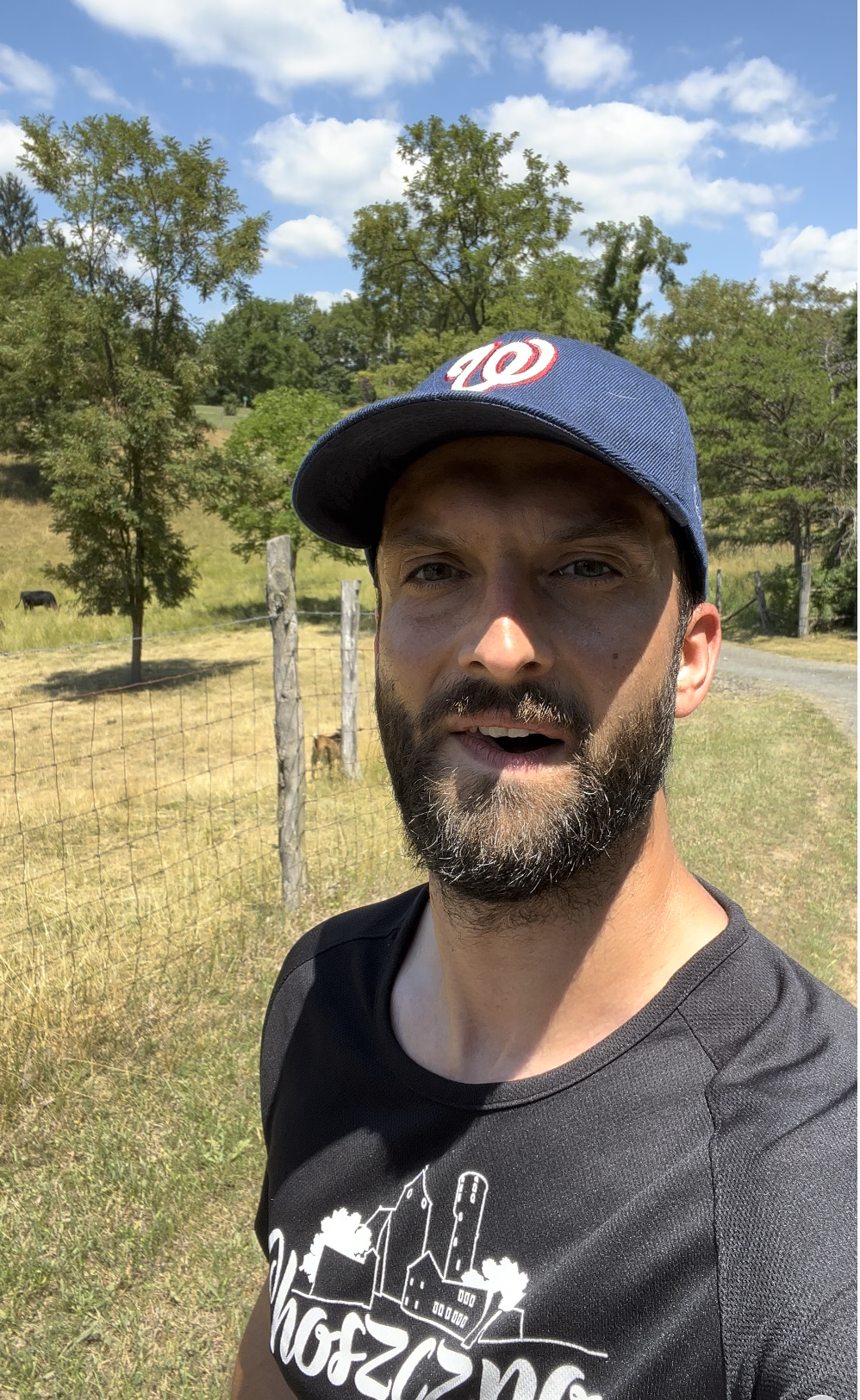 Łukasz Krawiec, your English teacher, outdoors on a sunny day